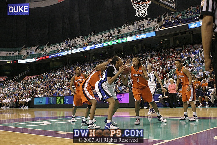 Carrem tries for the layup but Lyndra Littles is there for the Cavs...