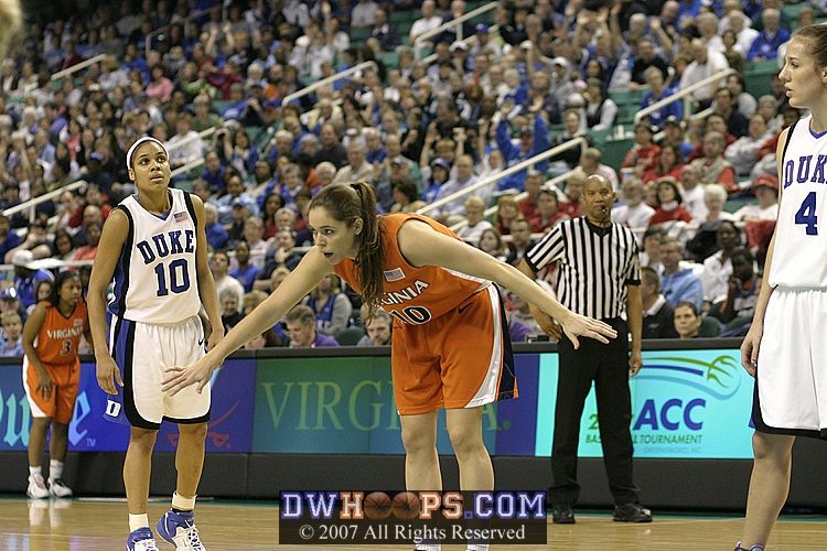 Lindsey Harding watches Brenna McGuire try to avoid a lane violation during the Smith made freethrows.