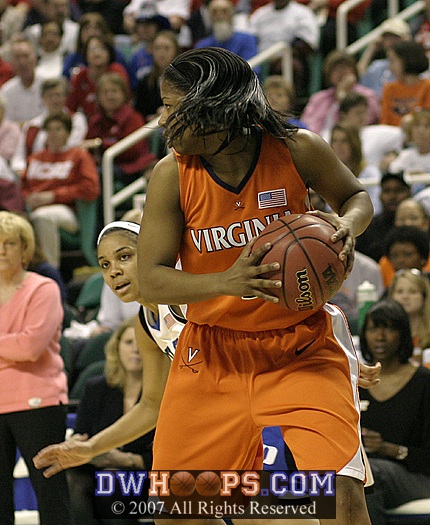 Lindsey Harding peers around Paulisha Kellum after a rebound