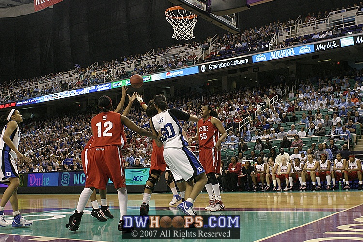 ...and three State players converged on the rebound