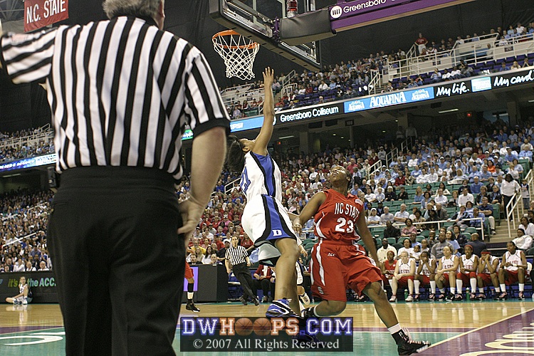Going for the rebound, Joy Cheek is fouled by Shayla Fields