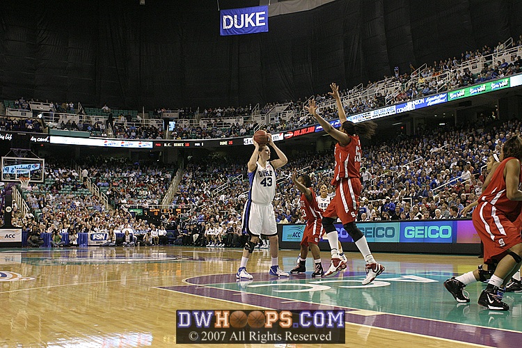 Gillian Goring moves out to defend Ali at the free throw line...