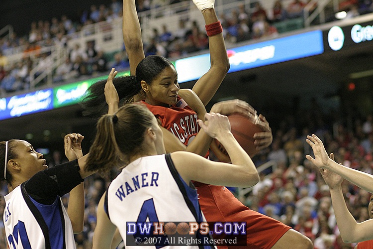 Keisha Brown rebounds a Bales miss