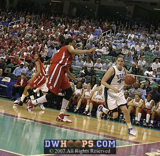 Alison Bales drives down the baseline...