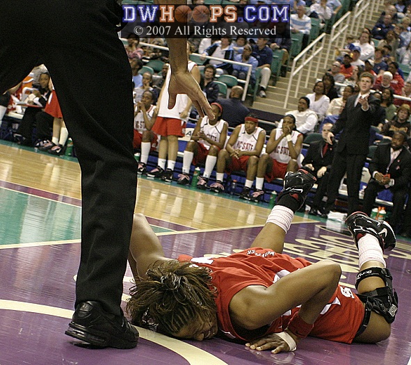 While Wittington writhed in pain on the baseline, State broke for scored a "shorthanded" basket.