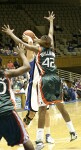 Alison Bales works at the top of the key, defended by Miami's Carla Williams