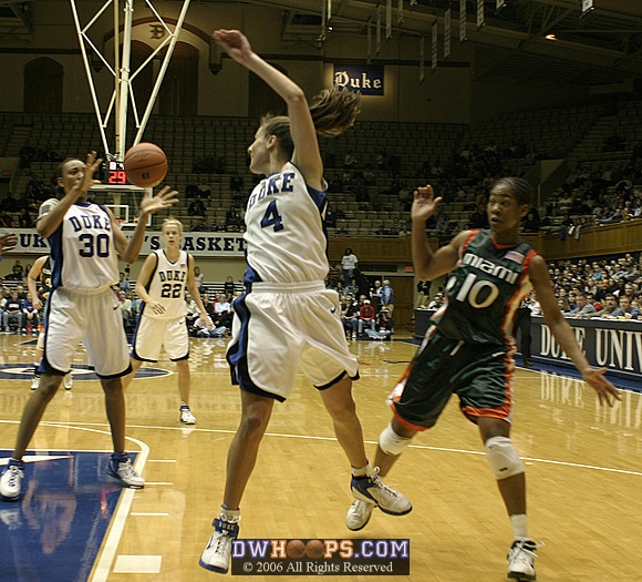 Abby Waner makes the acrobatic pass to Carrem Gay...