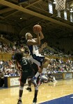 Linsdey Harding elevates for the shot, undercut by Miami's Renee Taylor and Latoya Cunningham