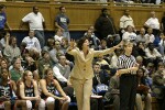 Miami Head Coach Katie Meier directs her defense, as official Sally Bell looks on