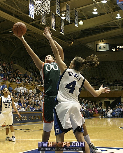 Abby Waner frustrates Miami center Amy Audibert in the post.  Audibert finished 0-2 from the field in limited action.