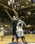 Abby Waner frustrates Miami center Amy Audibert in the post.  Audibert finished 0-2 from the field in limited action.