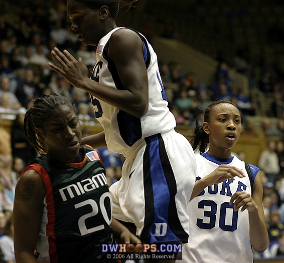 Bridgette Mitchell goes up and over Aubrey Grimsley (left) as Carrem Gay looks on