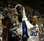 Bridgette Mitchell goes up and over Aubrey Grimsley (left) as Carrem Gay looks on
