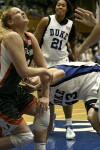 Alison Bales tries not to fall into Miami reserve Kathryn Hester