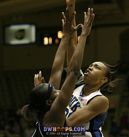 Carrem Gay goes strong to the basket and is fouled by Tech's Kentrina Wilson