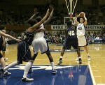 Alison Bales was tightly guarded inside all night - here she works the high post, about to dish to Wanisha Smith outside the arc.
