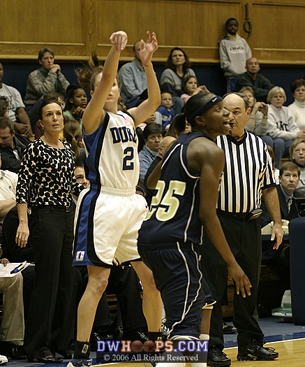 Georgia Tech head coach MaChelle Joseph and veteran official Tommy Salerno look on as Emily Waner attempts a 3 pointer