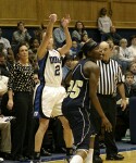 Georgia Tech head coach MaChelle Joseph and veteran official Tommy Salerno look on as Emily Waner attempts a 3 pointer