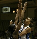 Carrem Gay goes strong to the basket and is fouled by Tech's Kentrina Wilson