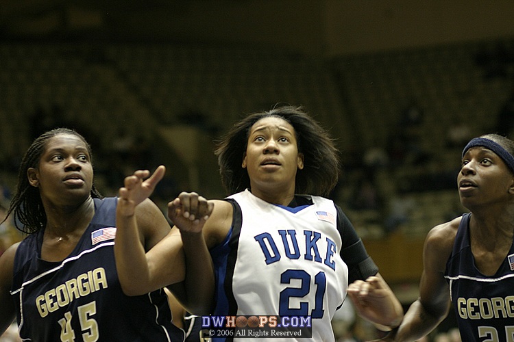 Daphne Mitchell (left), Joy Cheek, and Kentrina Wilson watch a Carrem Gay free throw drop