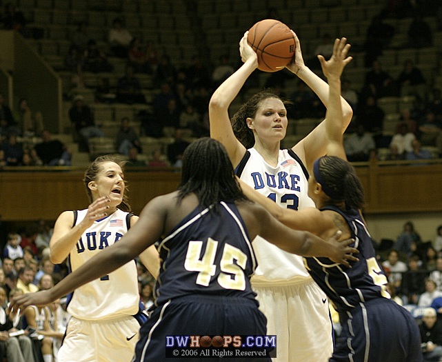 Abby Waner calls for the ball as Alison Bales is doubleteamed in the high post