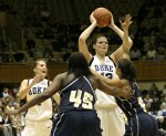 Abby Waner calls for the ball as Alison Bales is doubleteamed in the high post