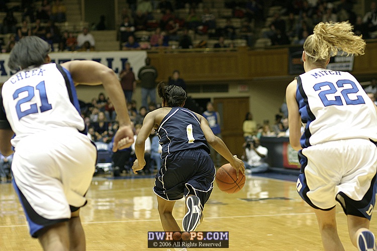 After rebounding a rare Abby Waner miss, Jacqua Williams speeds downcourt...