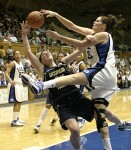 Alison Bales is whistled for the foul while attempting to block Brigitte Ardosi.  She finished the night with 6 blocks, extending her ACC record.