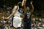 Chioma Nnamaka attempts a 3 pointer over Alison Bales