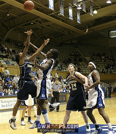 Bridgette Mitchell is whistled for the foul on Jacqua Williams' jumper, as Ardossi and Jackson look on