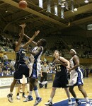 Bridgette Mitchell is whistled for the foul on Jacqua Williams' jumper, as Ardossi and Jackson look on