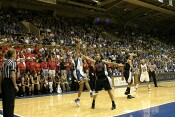 Guarded by Kristi Tolliver, Lindsey Harding attempts a jump shot...