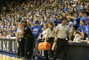 An ill Duke student was helped from the stands during the first half