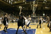 Closely guarded 1-on-1 by Laura Harper, Alison Bales twirls...
