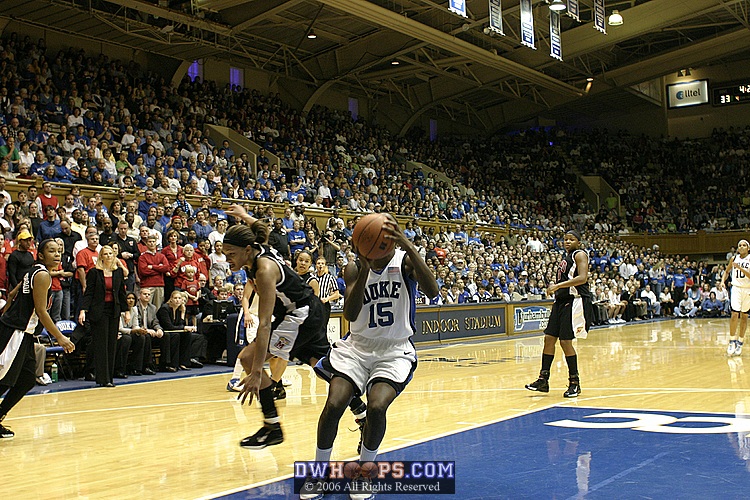 Bridgette Mitchell scores on a layup, extending the lead to 9
