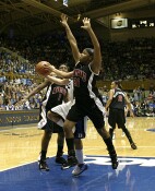 Ashleigh Newman's defense prevents Wanisha Smith from converting the layup.