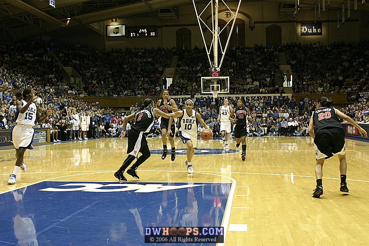 Sa'de Wiley-Gatewood can't prevent a Lindsey Harding layup (1 of 2)