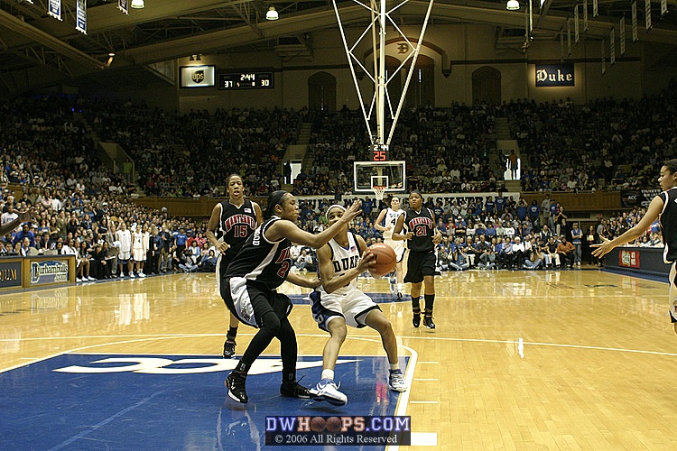 Sa'de Wiley-Gatewood can't prevent a Lindsey Harding layup (1 of 2)