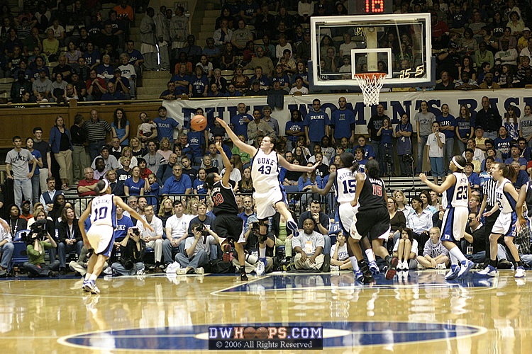 Alison Bales grabs the rebound after blocking Kristi Toliver, one of her five first half blocks.