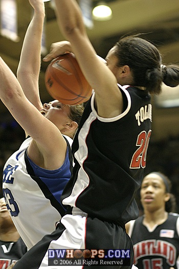 Kristi Toliver returns the favor at the other end by blocking Alison Bales.