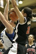 Kristi Toliver returns the favor at the other end by blocking Alison Bales.