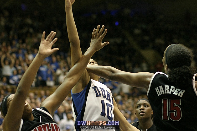 With seconds remaining in the first half, Laura Harper blocks Lindsey Harding's layup.
