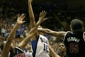 With seconds remaining in the first half, Laura Harper blocks Lindsey Harding's layup.