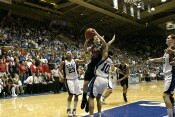 Lindsey Harding takes a charge from Shay Doron
