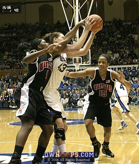 Alison Bales rebounds a Laura Harper miss, denying Crystal Langhorne the board.