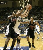 Alison Bales rebounds a Laura Harper miss, denying Crystal Langhorne the board.