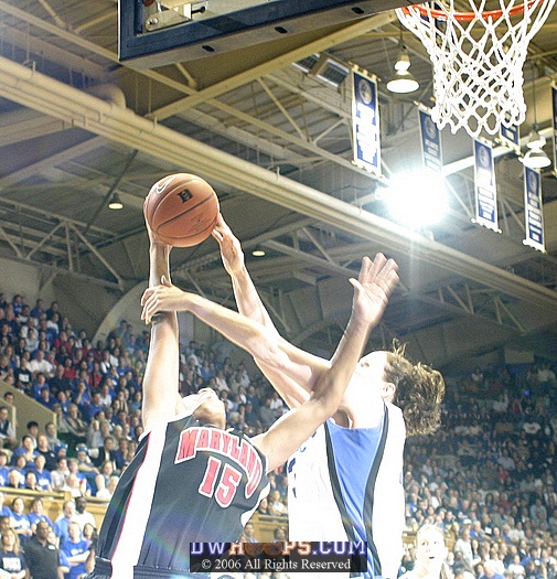The overhead flash semi-obliterates my shot of Alison Bales fouling Laura Harper