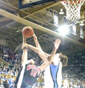 The overhead flash semi-obliterates my shot of Alison Bales fouling Laura Harper