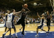 Alison Bales fouls Crystal Langhorne in the act.  She missed both free throws.