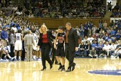Maryland coaches help Kristi Toliver off the court, after an apparent twisted ankle.  Toliver did not return.